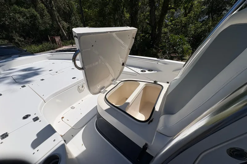 Slide: The Image of 2018 ShearWater 26 Carolina boat with open storage compartment on deck. - 8