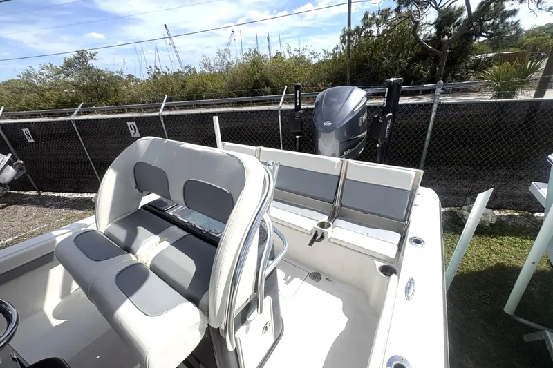 Slide: The Image of 2018 ShearWater 26 Carolina boat interior with seating and Yamaha engine. - 9