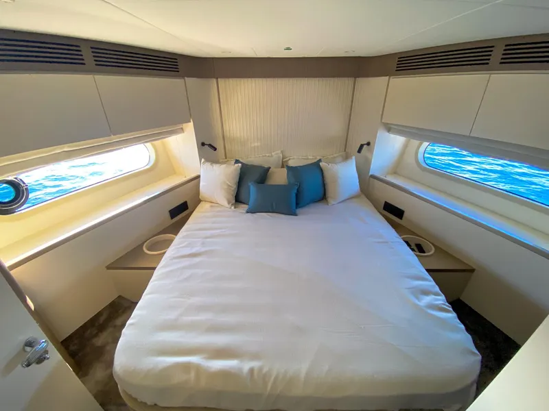Slide: The Image of Luxurious bedroom interior of 2025 Azimut Magellano 60 yacht with ocean view windows. - 16