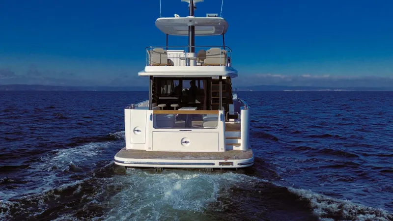 Slide: The Image of Azimut Magellano 60 yacht cruising on open sea, rear view, 2025 model. - 6