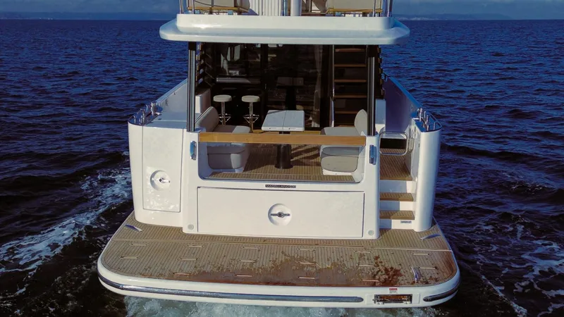 Slide: The Image of Azimut Magellano 60 yacht, 2025 model, rear view on open sea. - 7