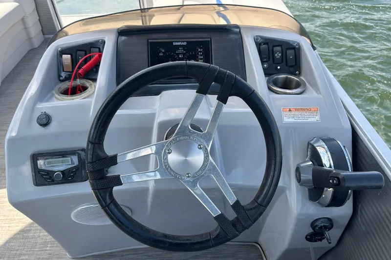 Slide: The Image of Steering console of 2023 Bennington 22 SSR boat with controls and display. - 10