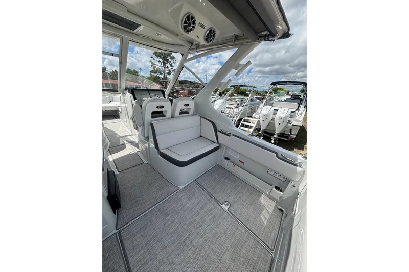 Slide: The Image of 2026 Crownline 280 DC boat interior with modern seating and sleek design. - 13