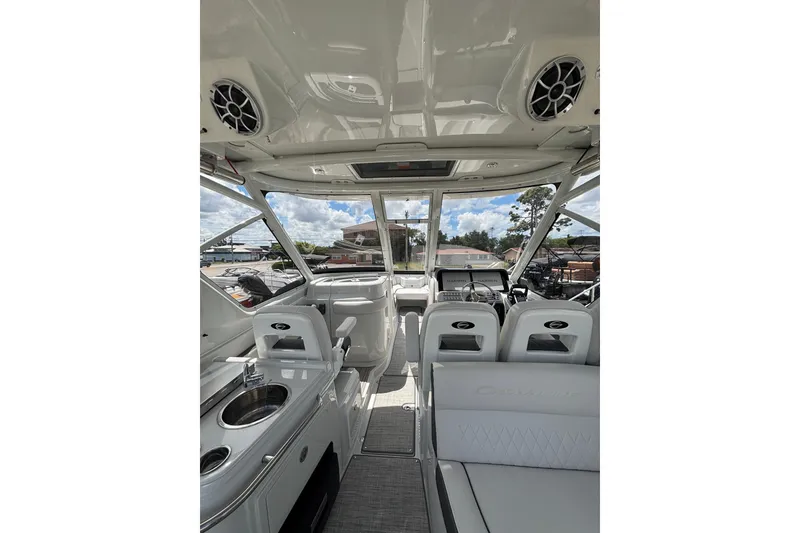 Slide: The Image of Interior of 2026 Crownline 280 DC boat, featuring sleek seating and modern amenities. - 17