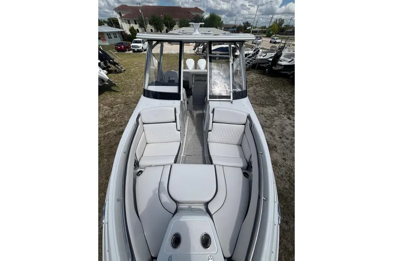 Slide: The Image of 2026 Crownline 280 DC boat with spacious seating and modern design. - 19