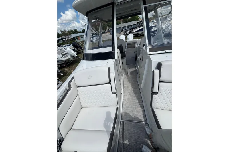 Slide: The Image of 2026 Crownline 280 DC boat interior with white seating and modern design. - 21
