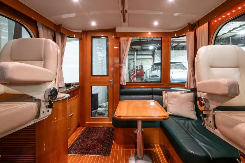 Slide: The Image of Luxurious interior of 2007 Grand Banks 39 Eastbay SX yacht with plush seating and wooden finishes. - 22