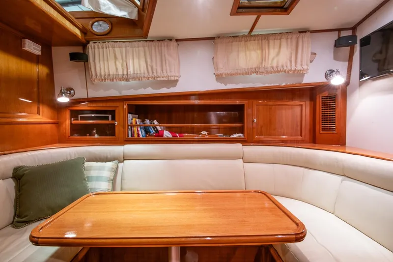 Slide: The Image of Luxurious 2007 Grand Banks 39 Eastbay SX yacht interior with elegant wood finish and cozy seating. - 30