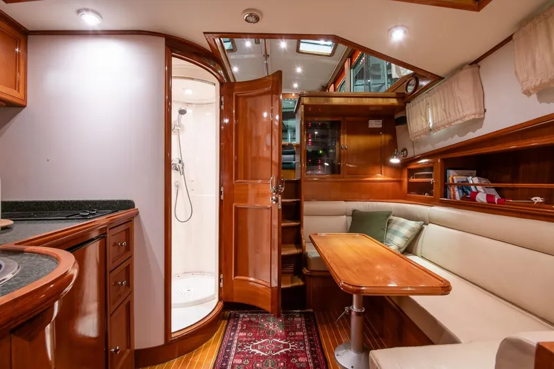 Slide: The Image of Luxurious 2007 Grand Banks 39 Eastbay SX yacht interior with elegant wood finishes and cozy seating. - 36