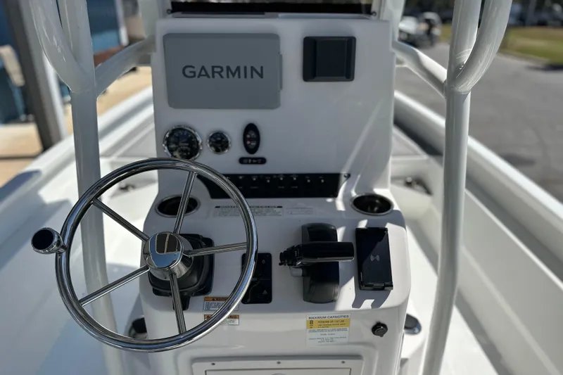 Slide: The Image of Steering console of 2024 Avid 23 Mag boat with Garmin navigation system. - 17
