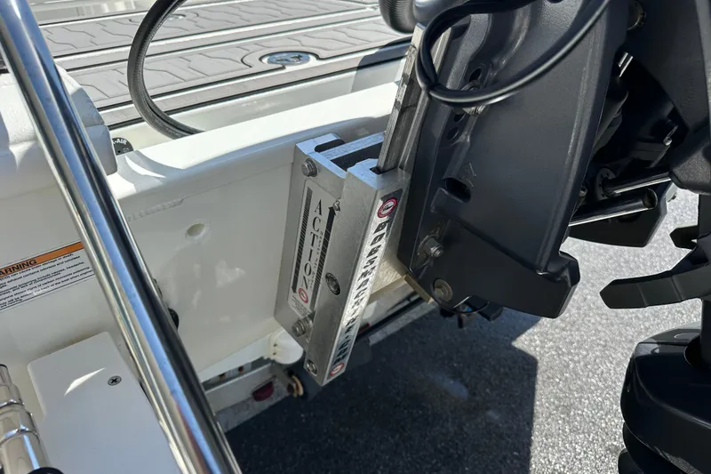 Slide: The Image of 2024 Avid 23 Mag boat with Action jack plate and motor mount detail. - 4