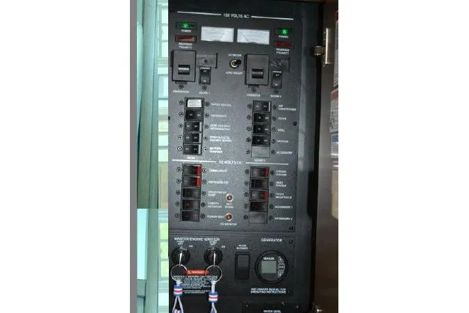 Slide: The Image of Electrical control panel on a 2017 Sea Ray Sundancer 370 boat. - 33