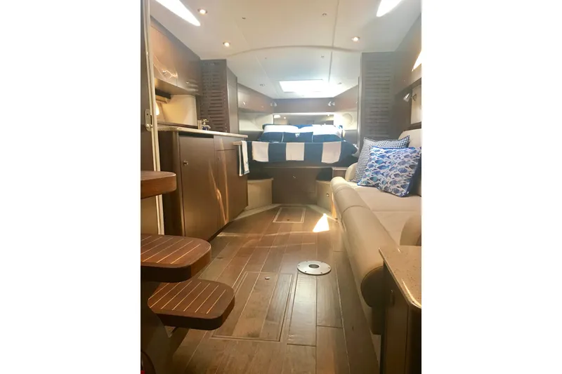 Slide: The Image of Luxurious interior of 2017 Sea Ray Sundancer 370 yacht with cozy seating and elegant decor. - 21