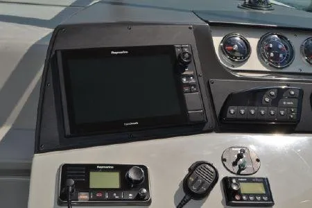 Slide: The Image of Control panel of a 2017 Sea Ray Sundancer 370 with navigation and communication equipment. - 16