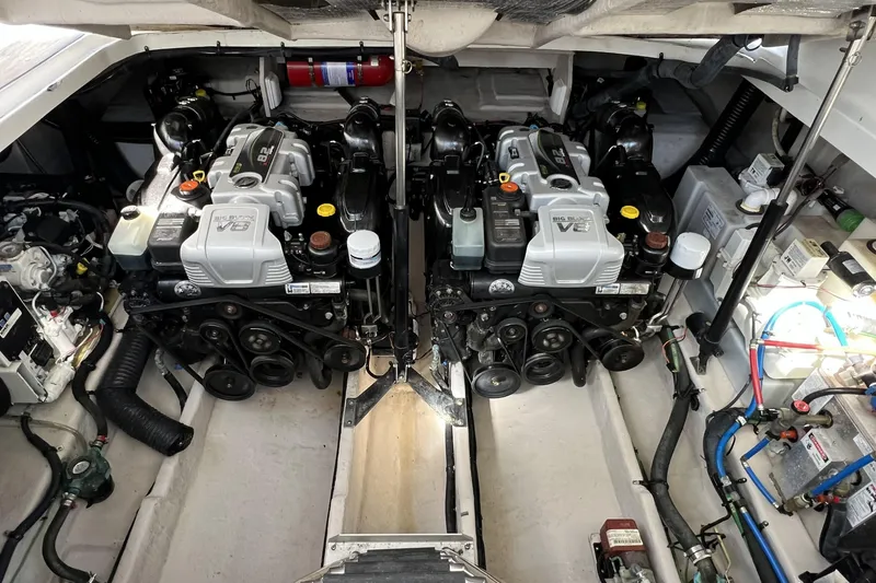 Slide: The Image of Engine room of 2017 Sea Ray Sundancer 370 with dual V8 engines and mechanical components. - 27