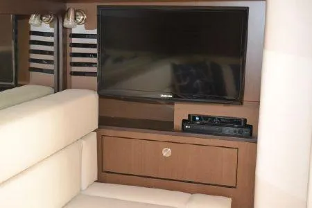 Slide: The Image of Interior of 2017 Sea Ray Sundancer 370 with TV and entertainment system. - 22