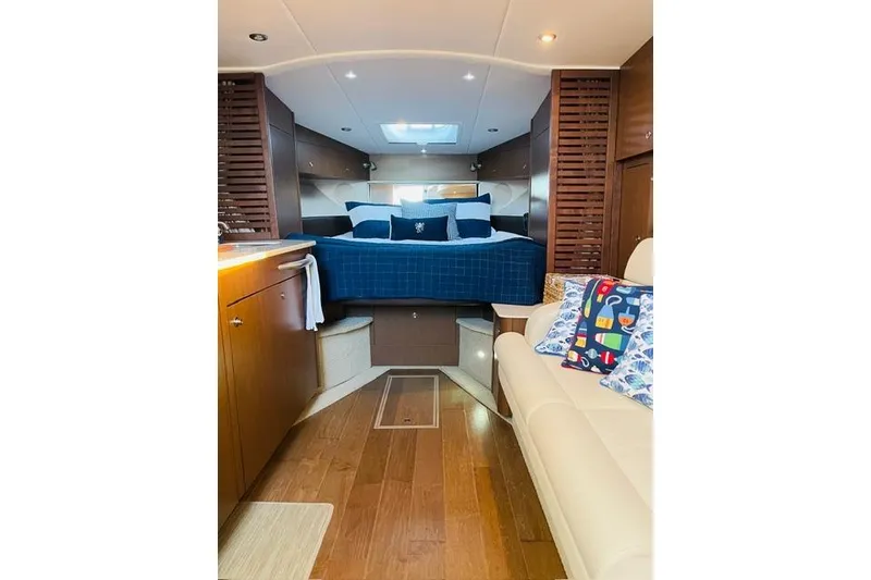 Slide: The Image of Luxurious interior of 2017 Sea Ray Sundancer 370 yacht with cozy bed and seating area. - 18