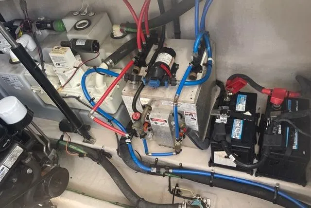 Slide: The Image of Engine compartment of 2017 Sea Ray Sundancer 370 with batteries and wiring. - 30