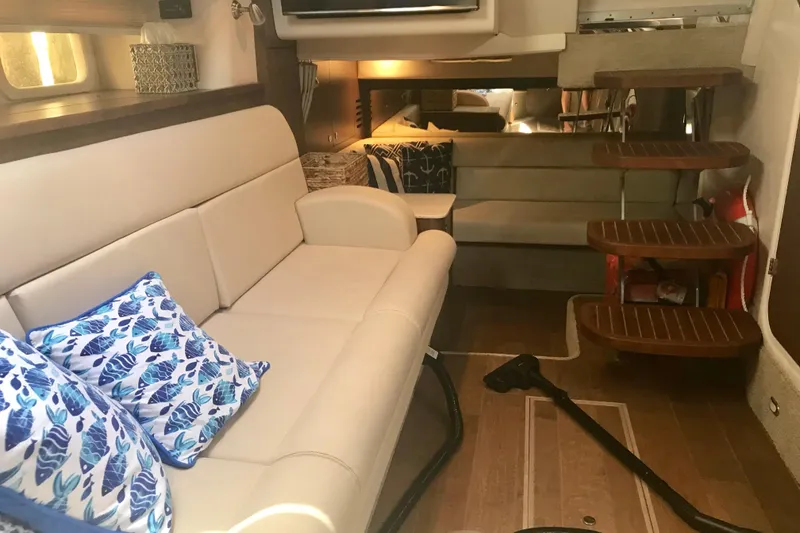 Slide: The Image of Interior of 2017 Sea Ray Sundancer 370 yacht with elegant seating and wooden steps. - 20