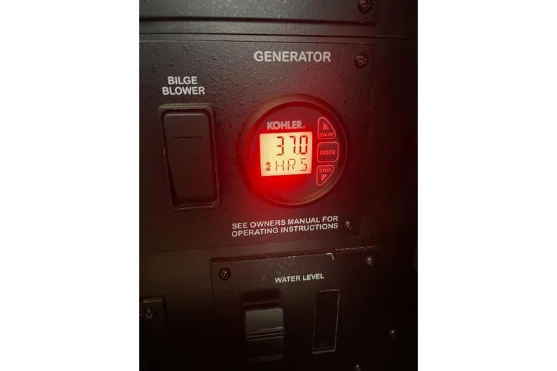 Slide: The Image of Control panel of a 2017 Sea Ray Sundancer 370, featuring a Kohler generator display. - 32