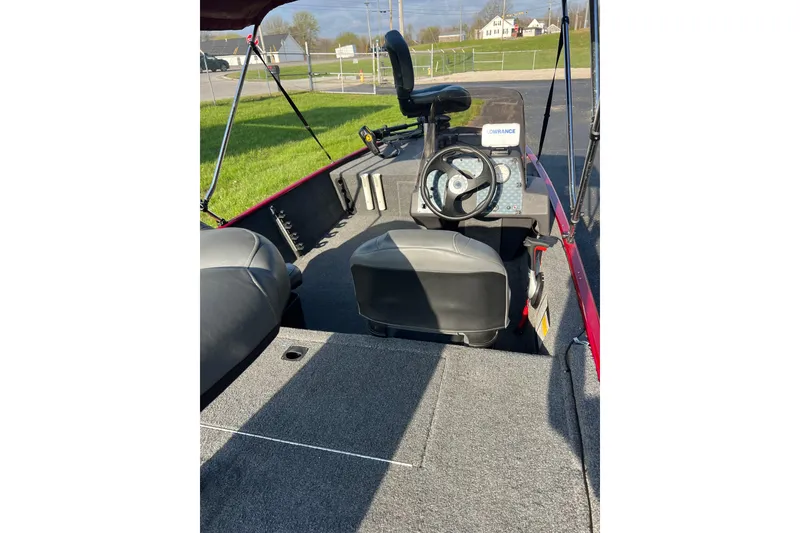 Slide: The Image of 2023 Tracker Bass Tracker Classic XL boat interior with steering console and seating. - 5