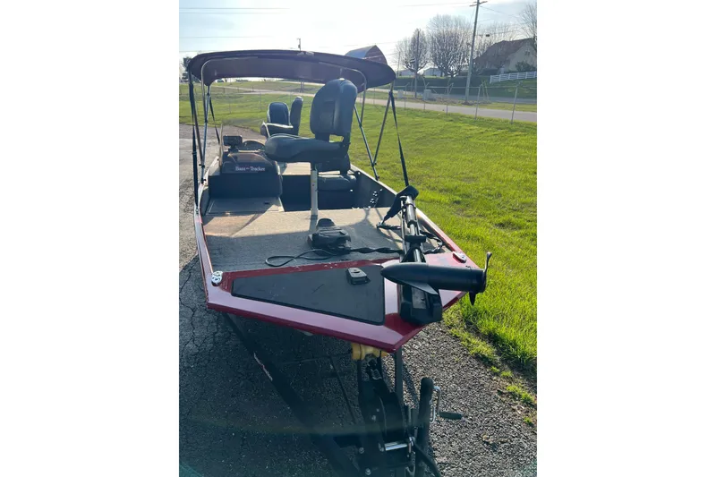 Slide: The Image of 2023 Tracker Bass Tracker Classic XL boat on a sunny day, parked on pavement. - 6