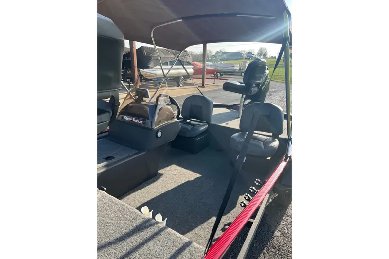 Slide: The Image of 2023 Tracker Bass Tracker Classic XL boat interior with seating and console. - 7