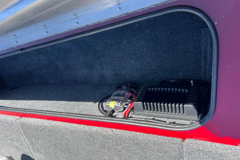 Slide: The Image of Storage compartment in a 2020 Tracker Pro Team 175 TXW boat with electronic equipment. - 16