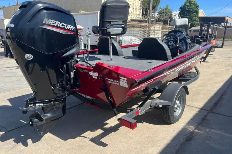 Slide: The Image of 2020 Tracker Pro Team 175 TXW boat with Mercury engine on trailer. - 2