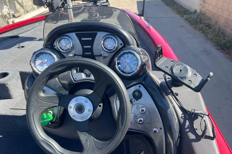 Slide: The Image of 2020 Tracker Pro Team 175 TXW boat dashboard with steering wheel and gauges. - 7