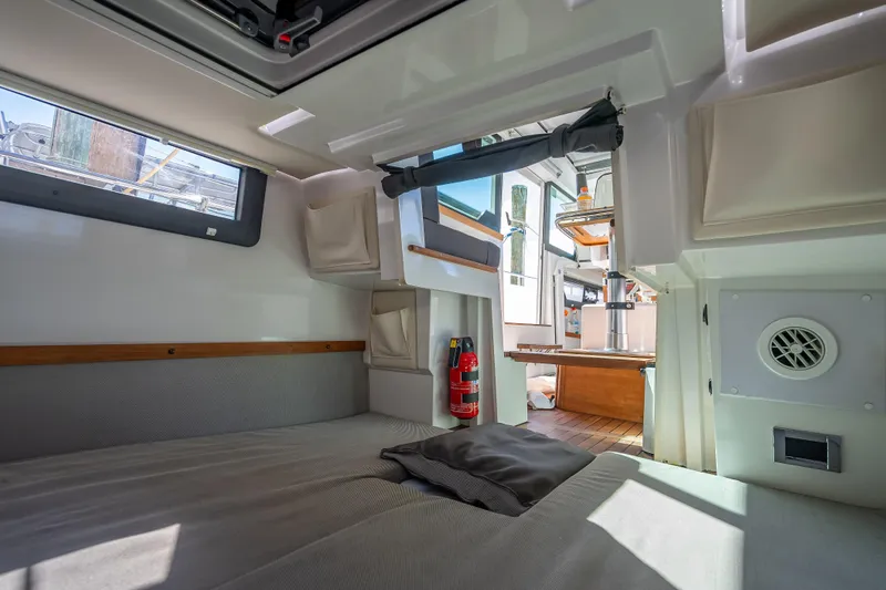 Slide: The Image of Interior of 2017 Axopar 37 XC Cross Cabin, featuring cozy sleeping area and modern amenities. - 17