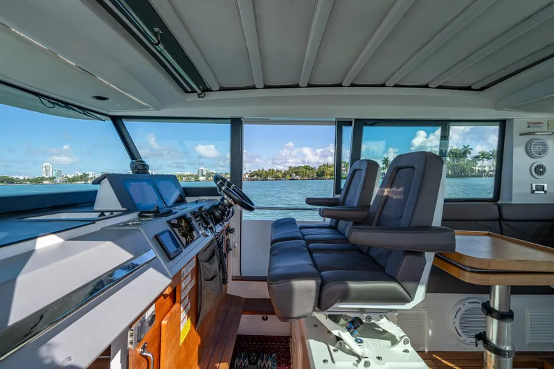 Slide: The Image of Interior of 2017 Axopar 37 XC Cross Cabin with modern helm and seating. - 6