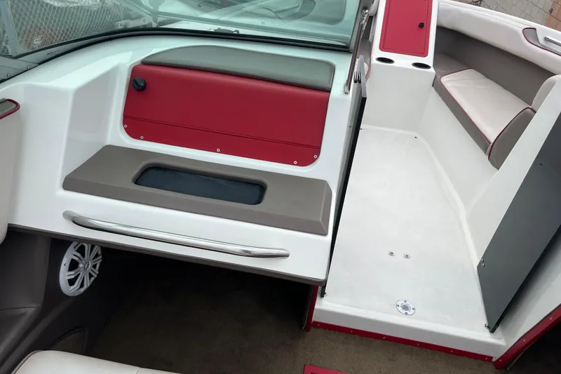 Slide: The Image of Interior of a 1996 Cobalt 220 boat with red and white seating. - 10