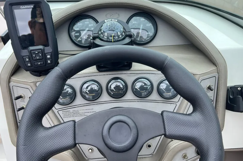 Slide: The Image of Dashboard of a 1996 Cobalt 220 boat with Garmin GPS and gauges. - 11