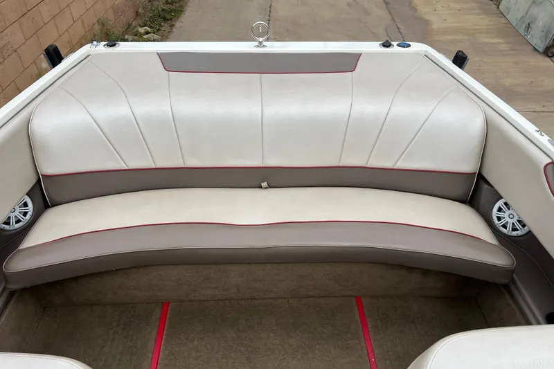Slide: The Image of Rear seating area of a 1996 Cobalt 220 boat with beige upholstery. - 13
