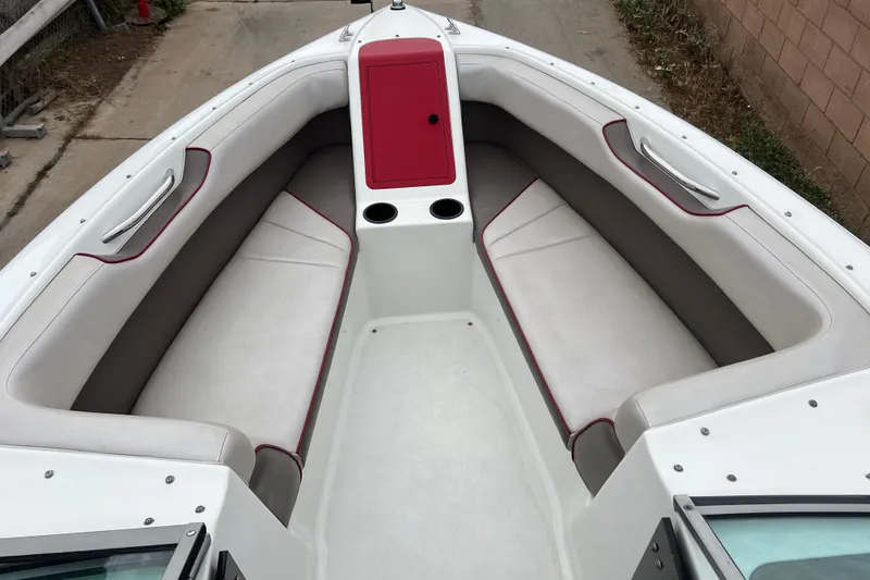 Slide: The Image of Interior of a 1996 Cobalt 220 boat with white and red seating. - 14