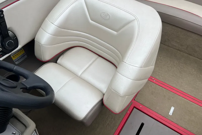 Slide: The Image of 1996 Cobalt 220 boat interior with white leather seating and red accents. - 15