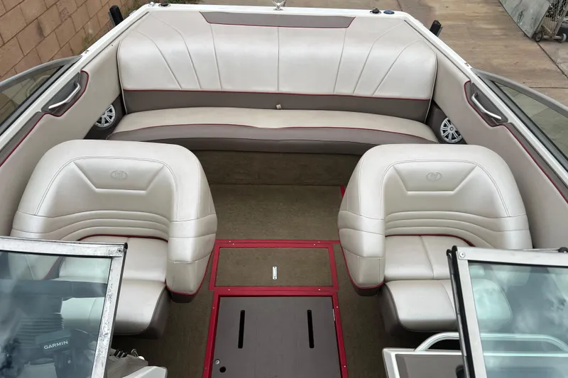 Slide: The Image of Interior of a 1996 Cobalt 220 boat with white leather seating. - 18