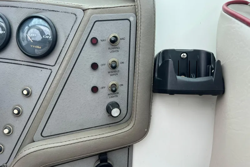 Slide: The Image of Open storage compartment on 1996 Cobalt 220 boat with red trim and white seats. - 24