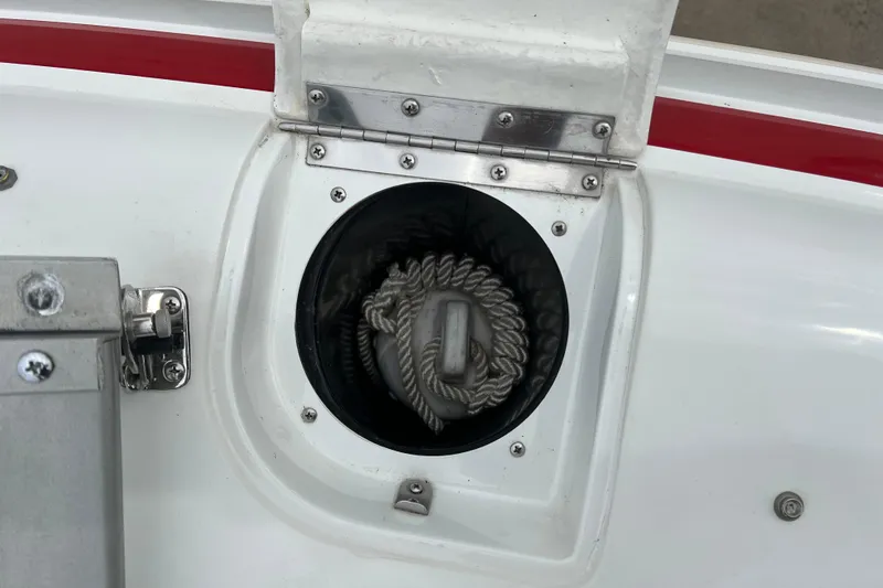 Slide: The Image of Red and white 1996 Cobalt 220 boat with sleek design and windshield. - 25