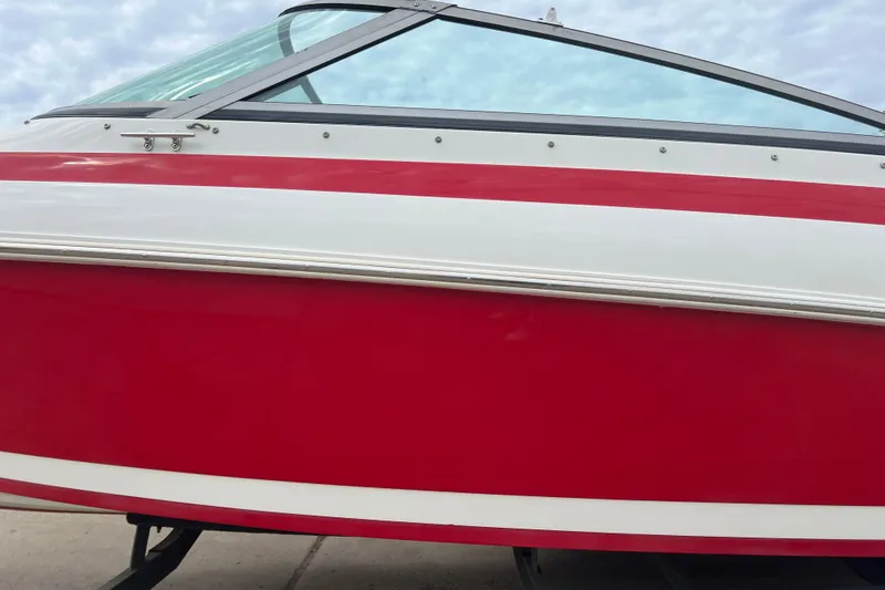 Slide: The Image of Engine compartment of a 1996 Cobalt 220 boat, showcasing various components and wiring. - 27