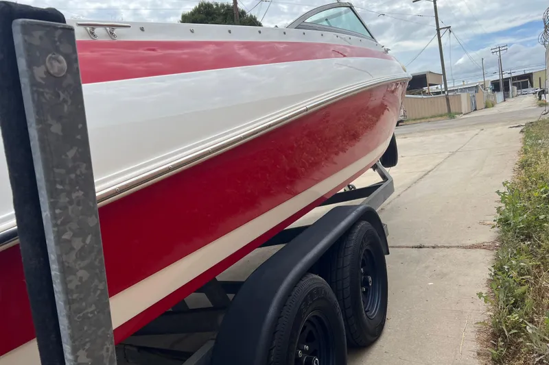 Slide: The Image of Engine compartment of a 1996 Cobalt 220 boat showing battery and wiring. - 28