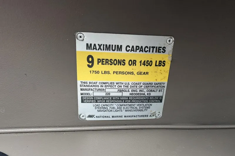 Slide: The Image of Trailer wheels of a 1996 Cobalt 220 boat on concrete surface. - 30