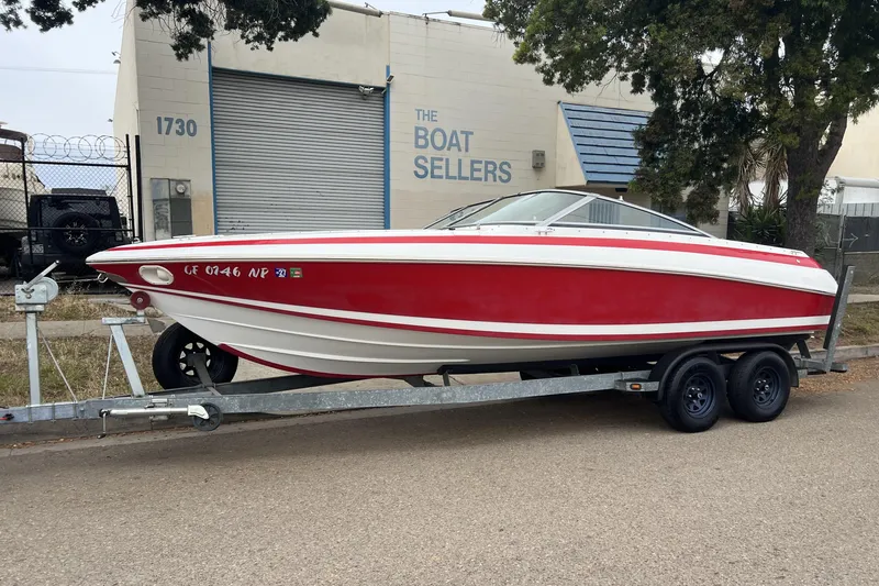 Slide: The Image of 1996 Cobalt 220 boat, rear view, showcasing seating and steering wheel. - 32