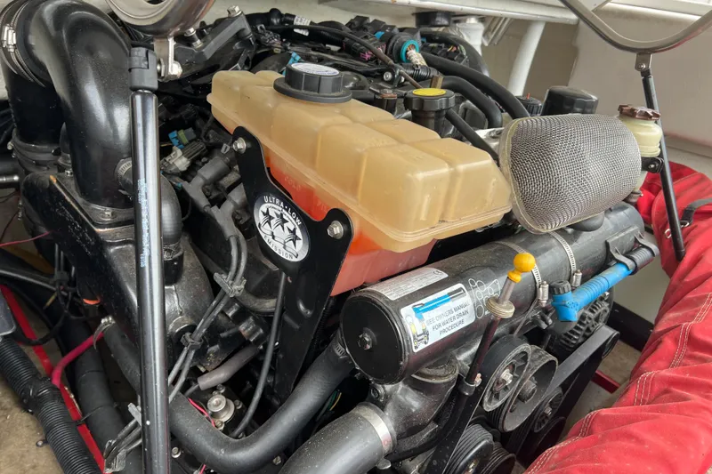 Slide: The Image of 1996 Cobalt 220 boat stern with MerCruiser outdrive and stainless steel propeller. - 9