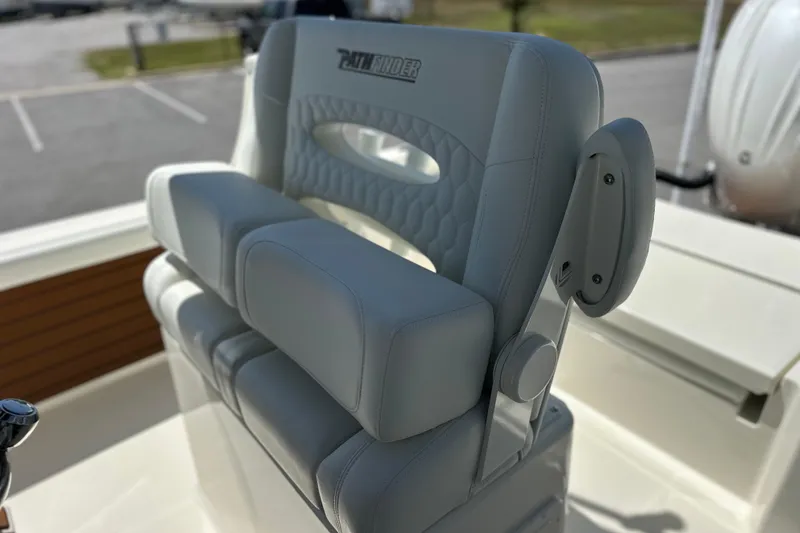 Slide: The Image of 2026 Pathfinder 2400 TRS boat seat with cushioned backrest and armrests. - 15