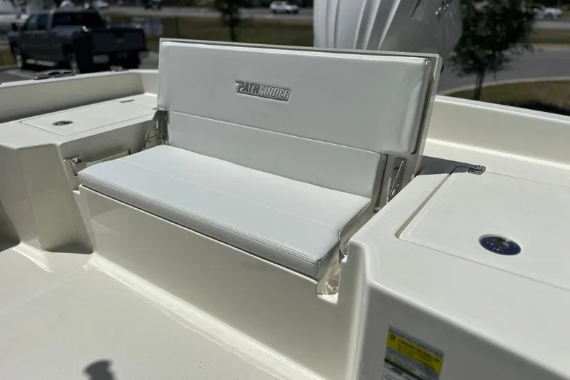 Slide: The Image of 2026 Pathfinder 2400 TRS boat with white cushioned seating and storage compartments. - 18
