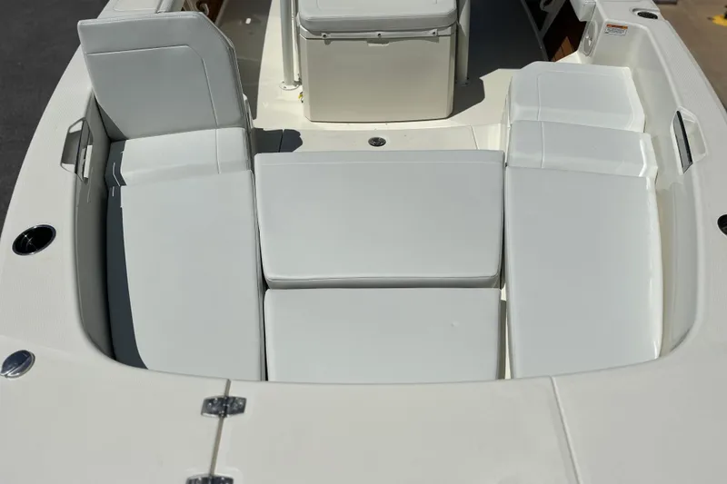 Slide: The Image of 2026 Pathfinder 2400 TRS boat interior with cushioned seating and storage compartments. - 20