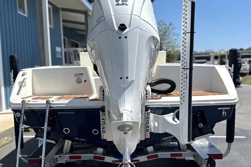 Slide: The Image of 2026 Pathfinder 2400 TRS boat with powerful outboard motor, parked on trailer. - 8