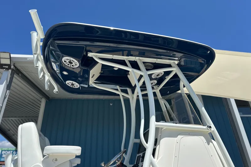 Slide: The Image of 2026 Pathfinder 2400 TRS boat with T-top and speakers, viewed from below. - 9